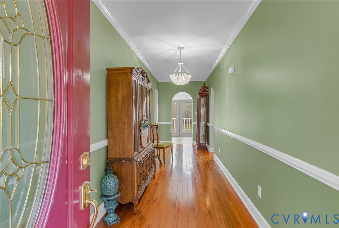 273 Sutton Avenue Reedville, VA 22539 - Photo 2 of 50 a view of entryway with wooden floor