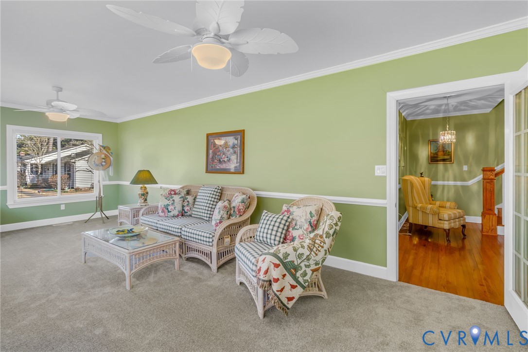 273 Sutton Avenue Reedville, VA 22539 - Photo 23 of 50 a living room with furniture and a large window