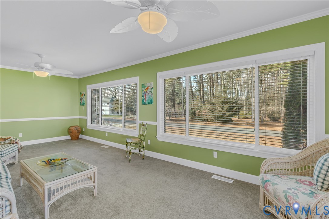 273 Sutton Avenue Reedville, VA 22539 - Photo 24 of 50 a living room with furniture and a window