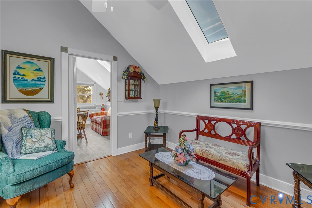 273 Sutton Avenue Reedville, VA 22539 - Photo 29 of 50 a bedroom with furniture and a wooden floor