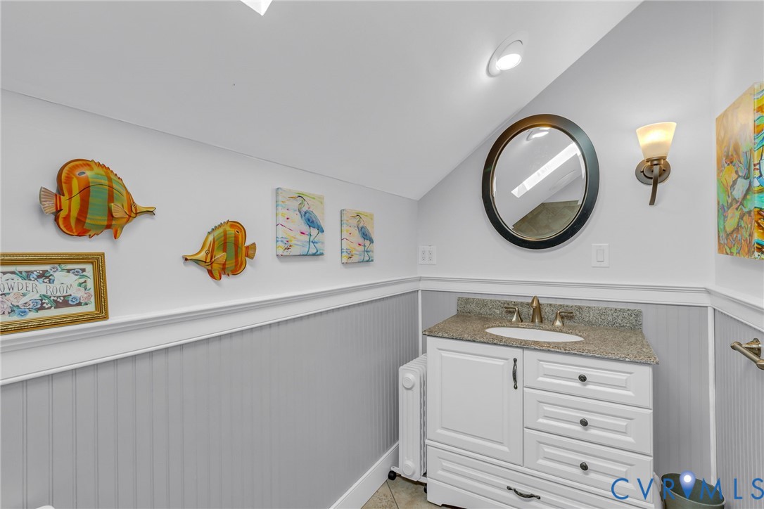 273 Sutton Avenue Reedville, VA 22539 - Photo 31 of 50 a bathroom with a sink and a mirror