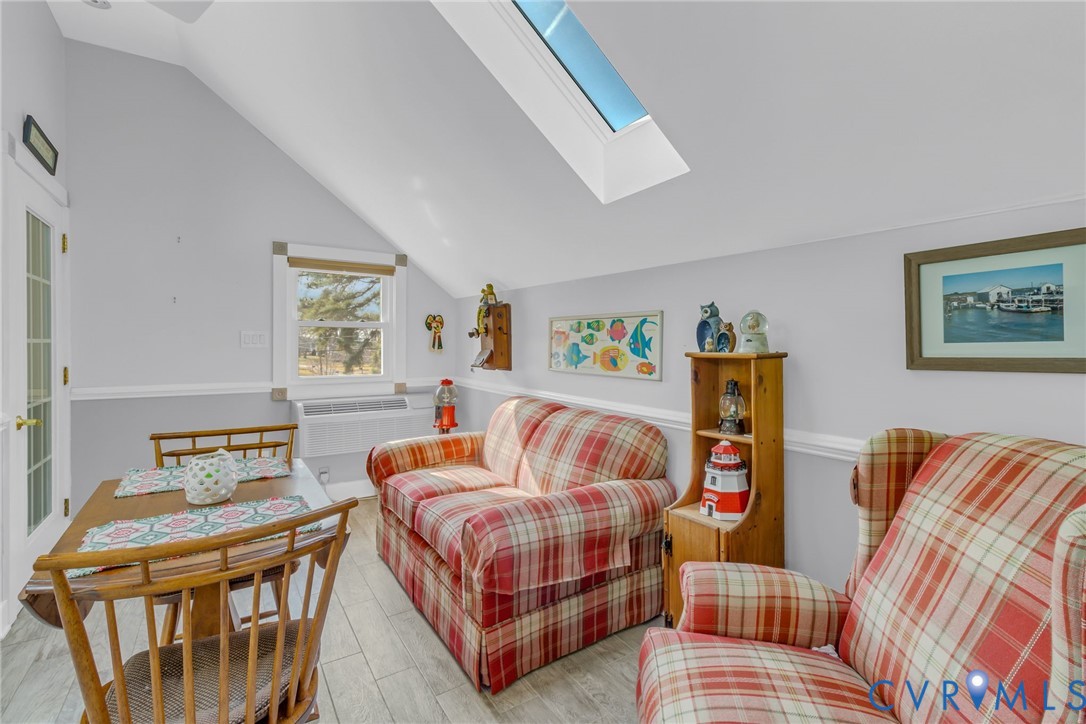 273 Sutton Avenue Reedville, VA 22539 - Photo 33 of 50 a bedroom with furniture and a window