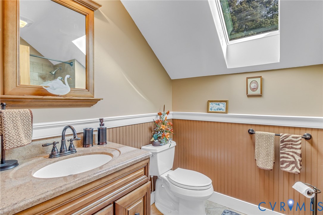 273 Sutton Avenue Reedville, VA 22539 - Photo 38 of 50 a bathroom with a granite countertop sink and a mirror