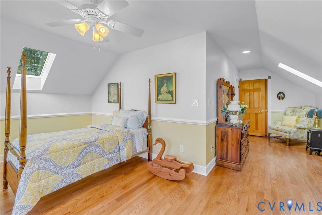 273 Sutton Avenue Reedville, VA 22539 - Photo 39 of 50 a bedroom with bed and wooden floor