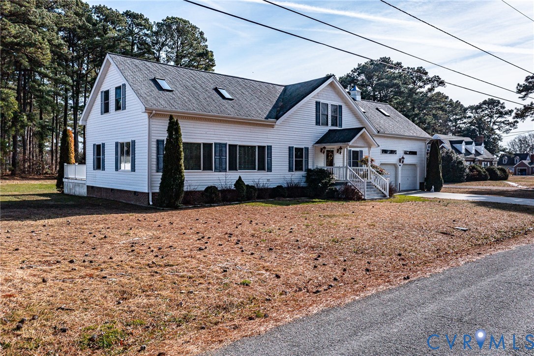 273 Sutton Avenue Reedville, VA 22539 - Photo 47 of 50 a front view of a house with a yard
