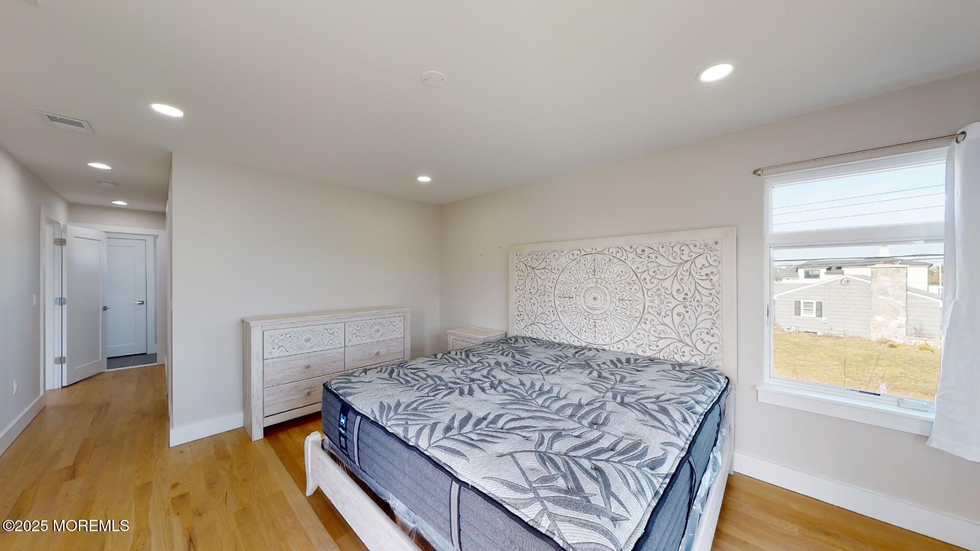 1 Howland Avenue Long Branch, NJ 07740 - Photo 11 of 22 a bedroom with a bed and a window