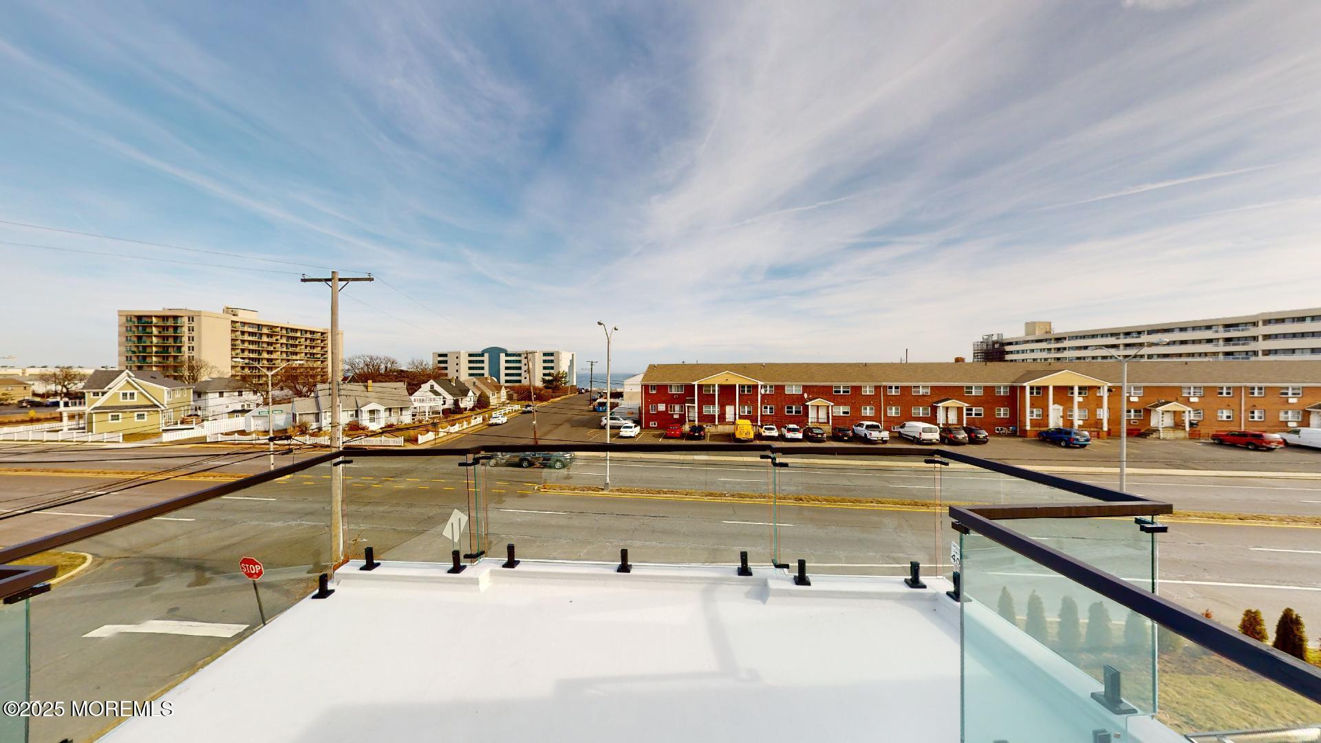 1 Howland Avenue Long Branch, NJ 07740 - Photo 19 of 22 a view of a swimming pool and outdoor seating