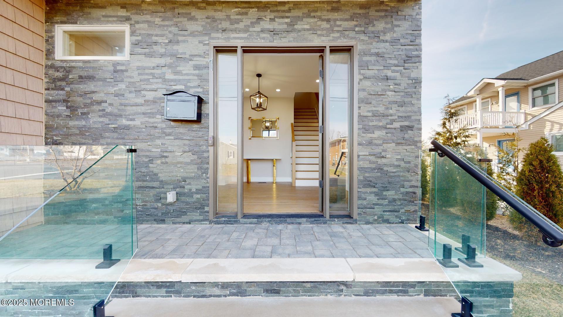 1 Howland Avenue Long Branch, NJ 07740 - Photo 2 of 22 a front view of a house with a yard