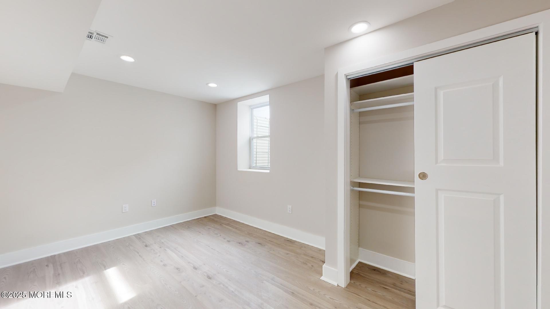 1 Howland Avenue Long Branch, NJ 07740 - Photo 22 of 22 a view of empty room with wooden floor