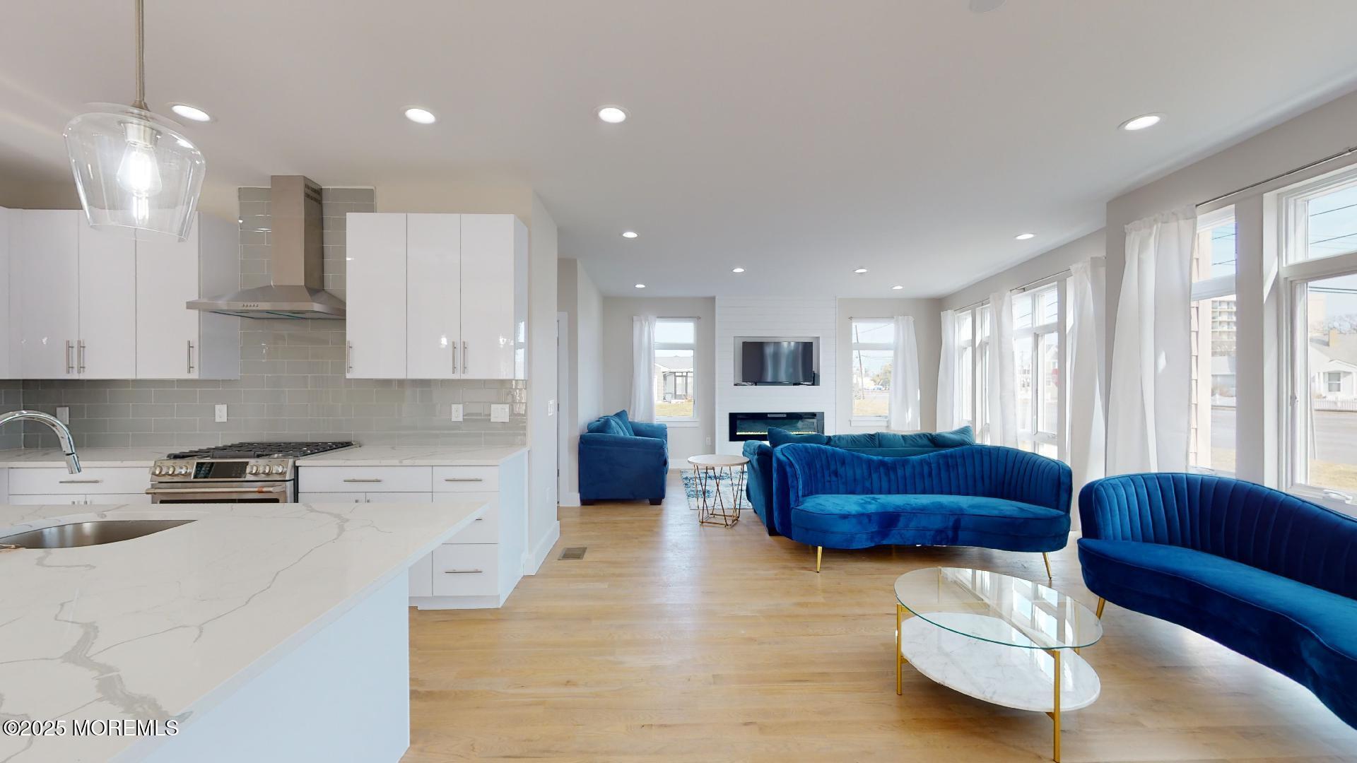 1 Howland Avenue Long Branch, NJ 07740 - Photo 7 of 22 a living room with furniture and kitchen view