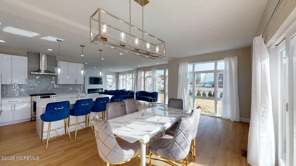 a large kitchen with a table and chairs