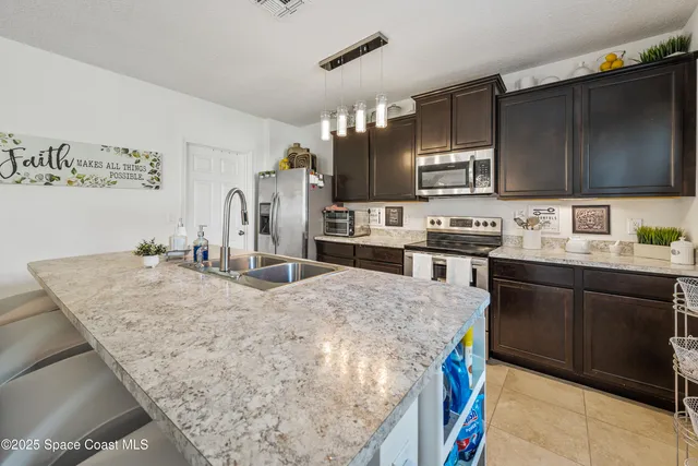a living room with fireplace furniture and a flat screen tv