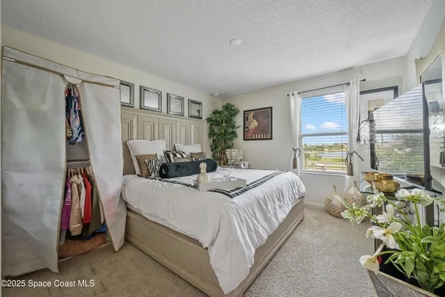 a bedroom with bed and a window