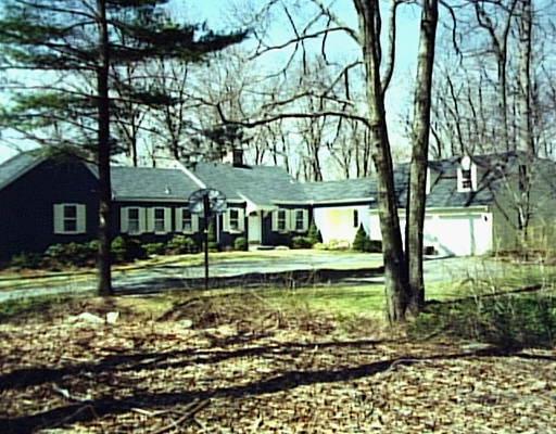 21 Rising Ridge Road Ridgefield, CT 06877 - Photo 1 of 1 a view of a house with a yard