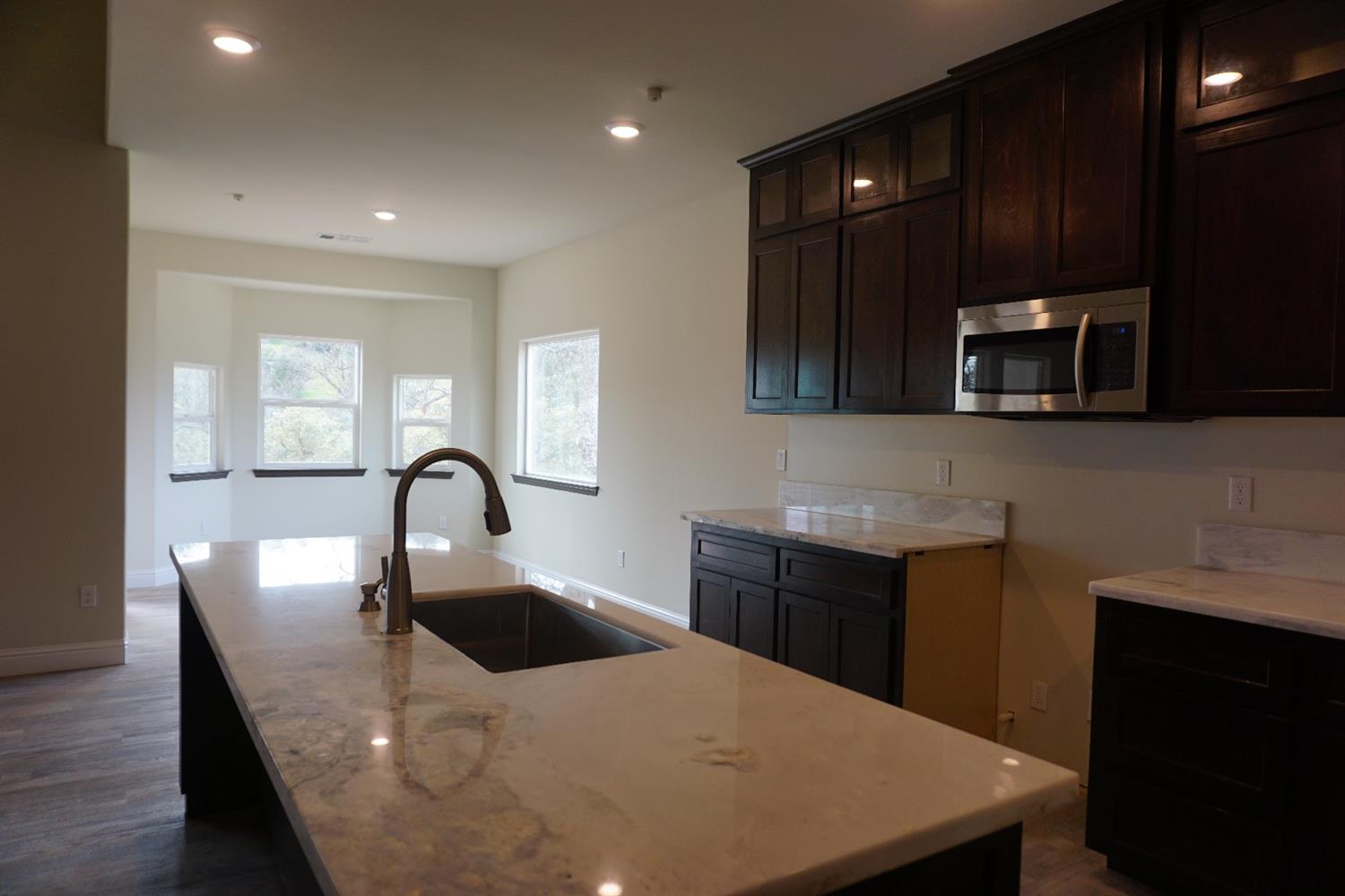 17573 Daley Road Madera, CA 93638 - Photo 10 of 23 Example of completed kitchen and dining area. Actual home may vary slightly.