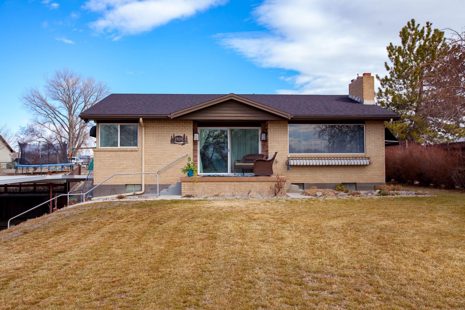 2520 G G 3/8 Road Grand Junction, CO 81505 - Photo 1 of 39 a front view of a house with a yard