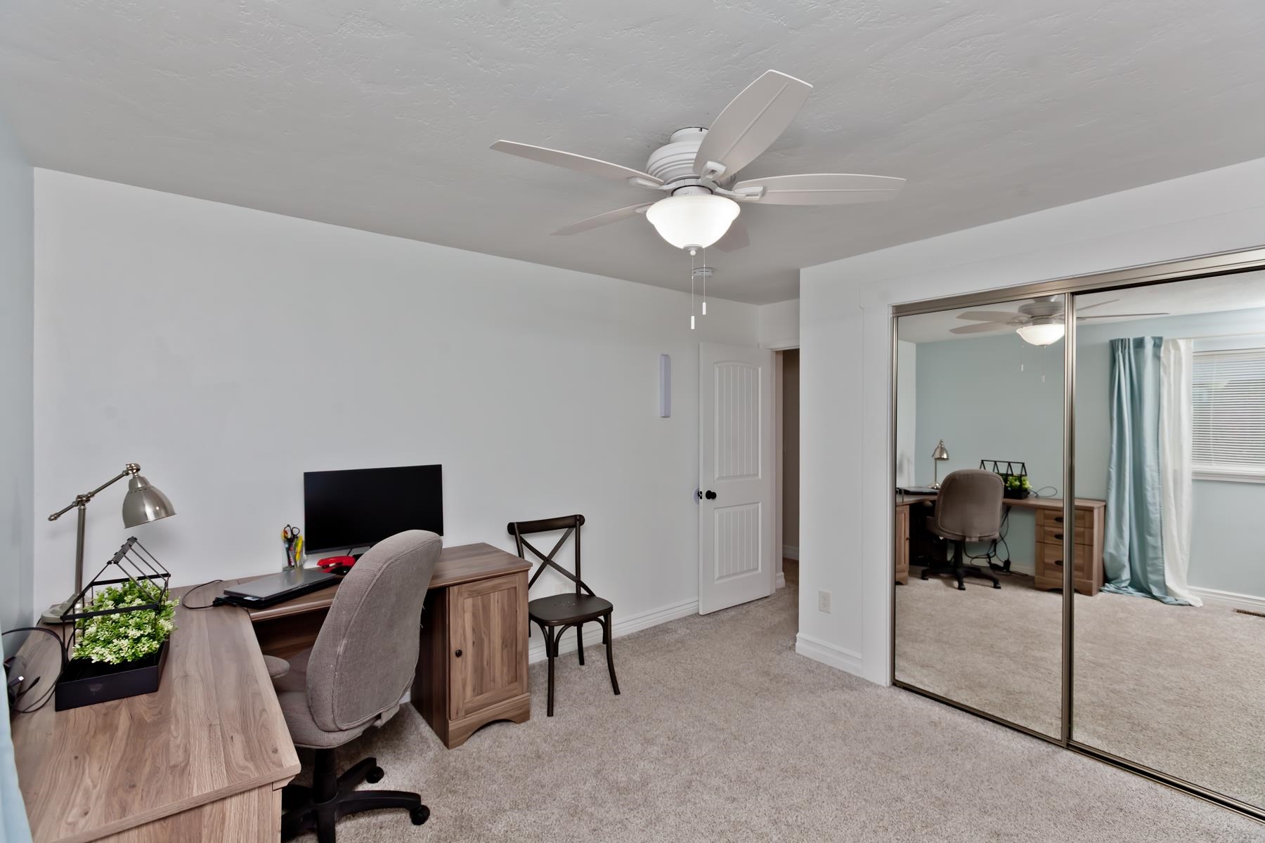 2520 G G 3/8 Road Grand Junction, CO 81505 - Photo 17 of 39 a view of a workspace with furniture and bedroom view