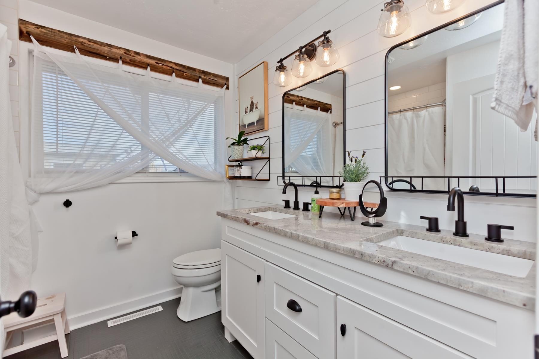 2520 G G 3/8 Road Grand Junction, CO 81505 - Photo 20 of 39 a bathroom with a granite countertop sink vanity mirror and toilet