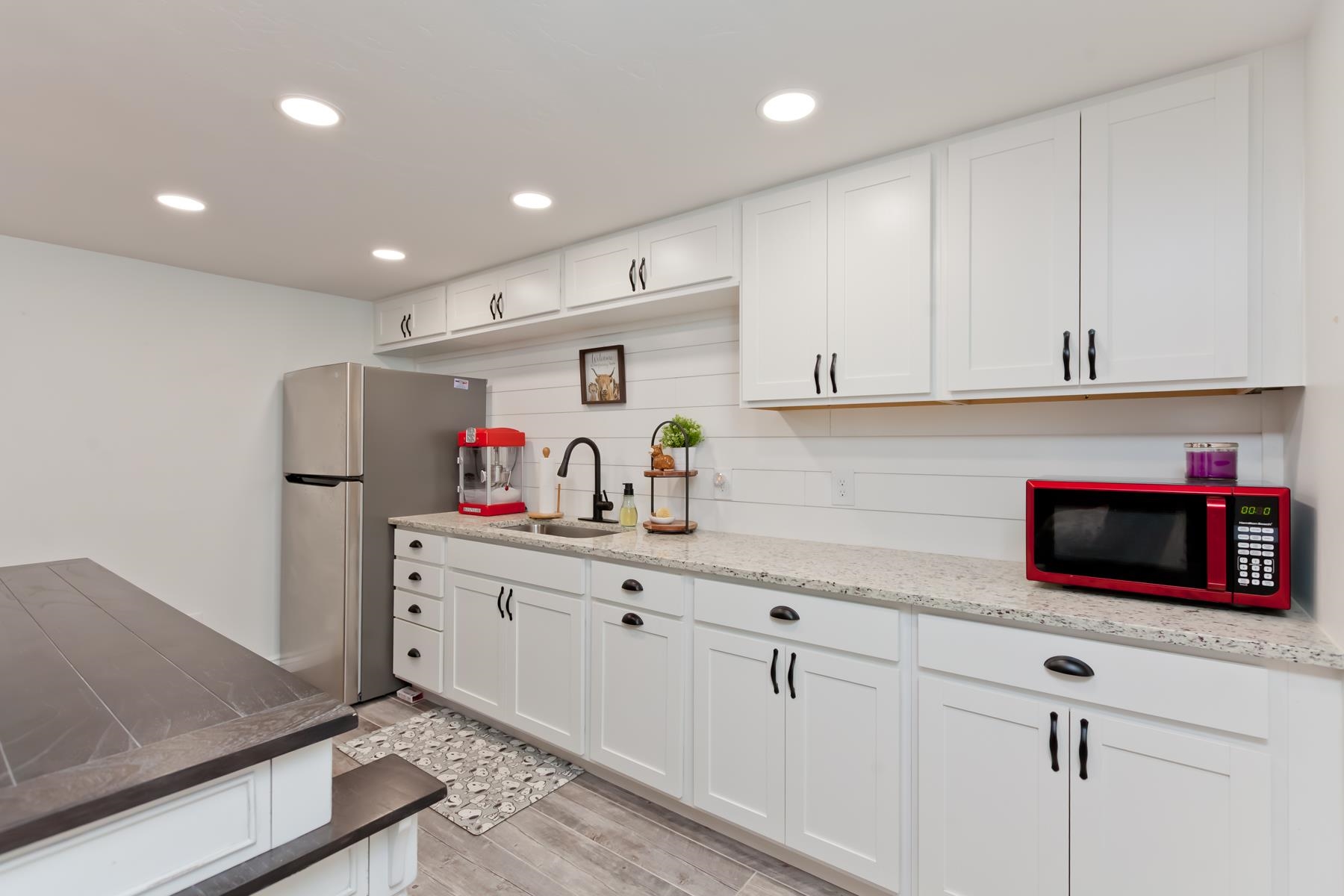 2520 G G 3/8 Road Grand Junction, CO 81505 - Photo 34 of 39 a kitchen with white cabinets and stainless steel appliances