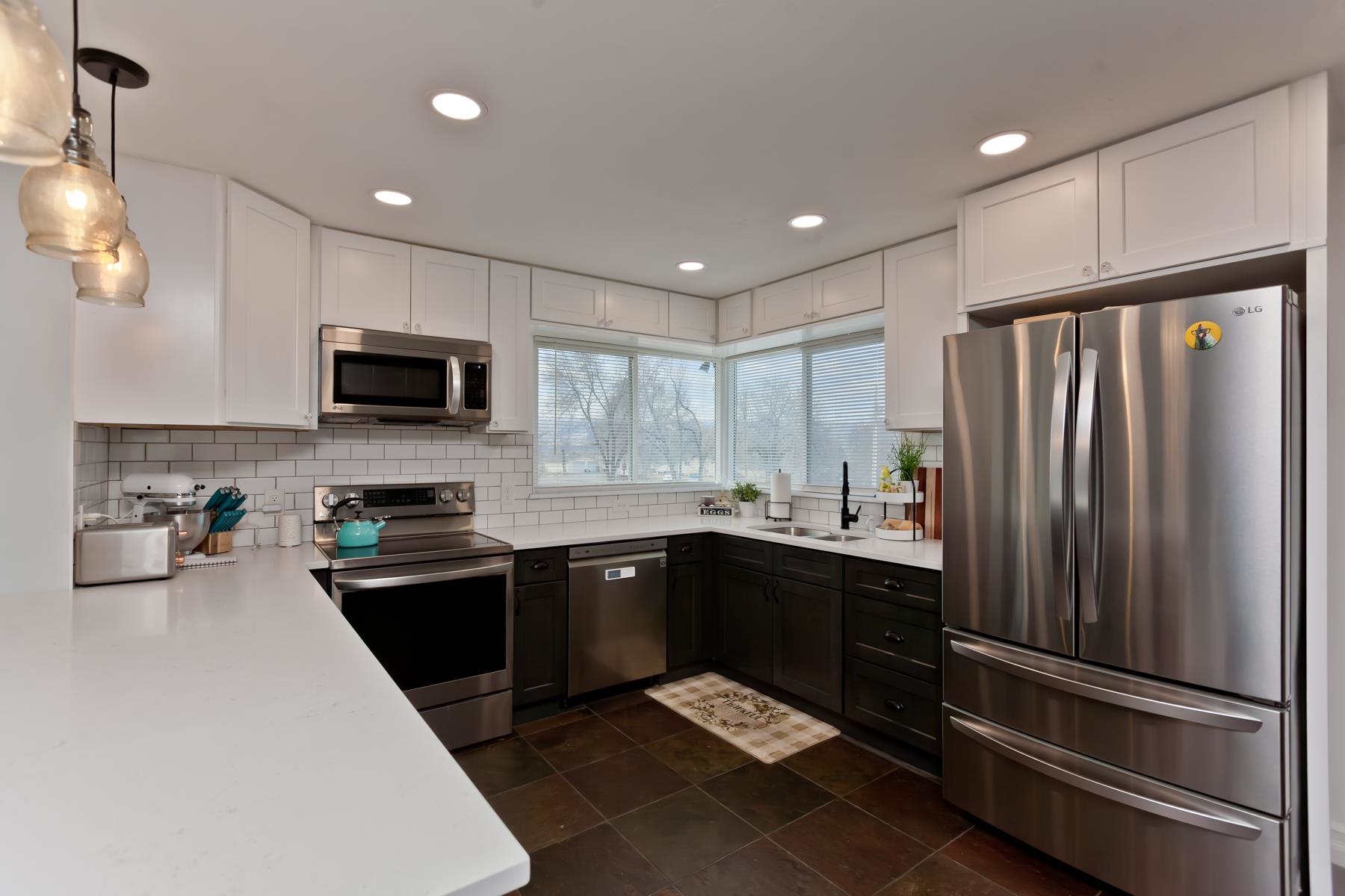 2520 G G 3/8 Road Grand Junction, CO 81505 - Photo 4 of 39 a kitchen with stainless steel appliances granite countertop a refrigerator sink and microwave