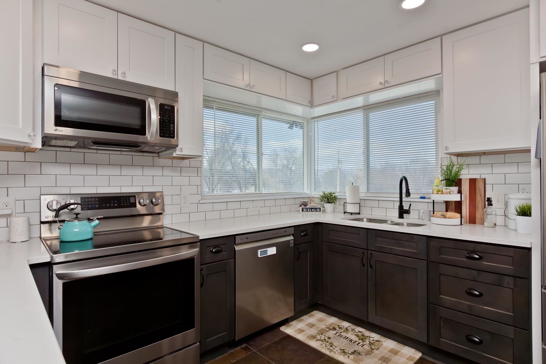 2520 G G 3/8 Road Grand Junction, CO 81505 - Photo 5 of 39 a kitchen with a sink stove and microwave