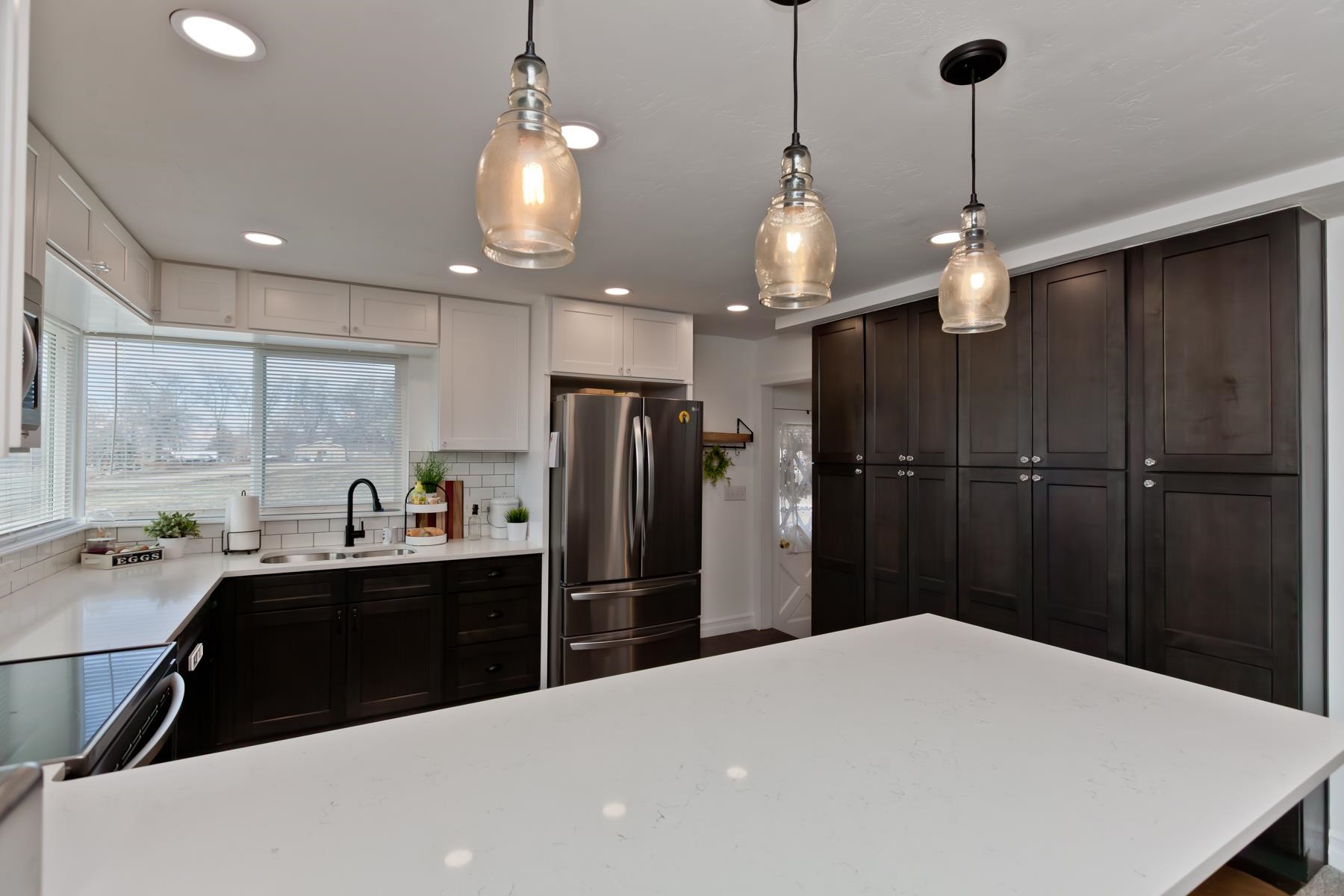 2520 G G 3/8 Road Grand Junction, CO 81505 - Photo 7 of 39 a kitchen with a refrigerator a sink and cabinets