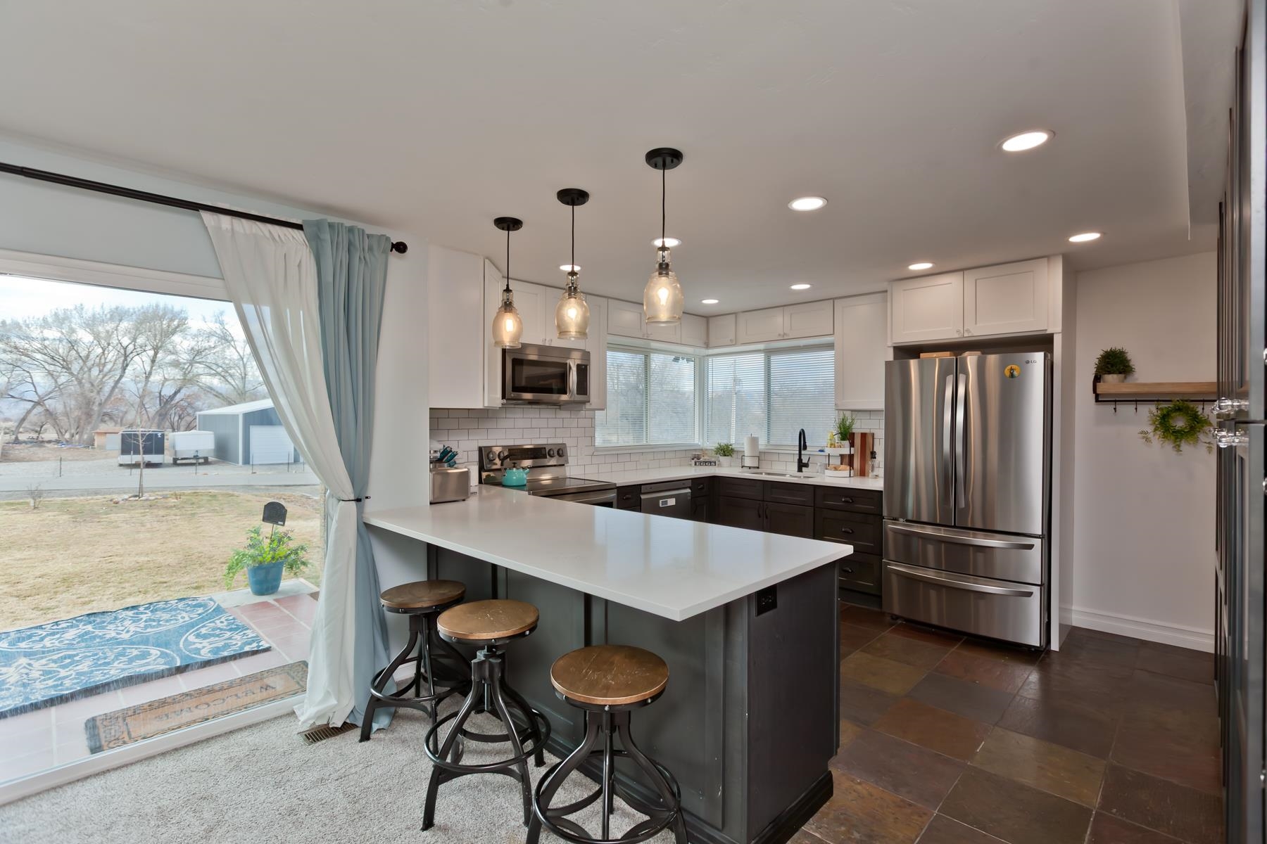 2520 G G 3/8 Road Grand Junction, CO 81505 - Photo 8 of 39 a kitchen with stainless steel appliances granite countertop a refrigerator and a stove top oven