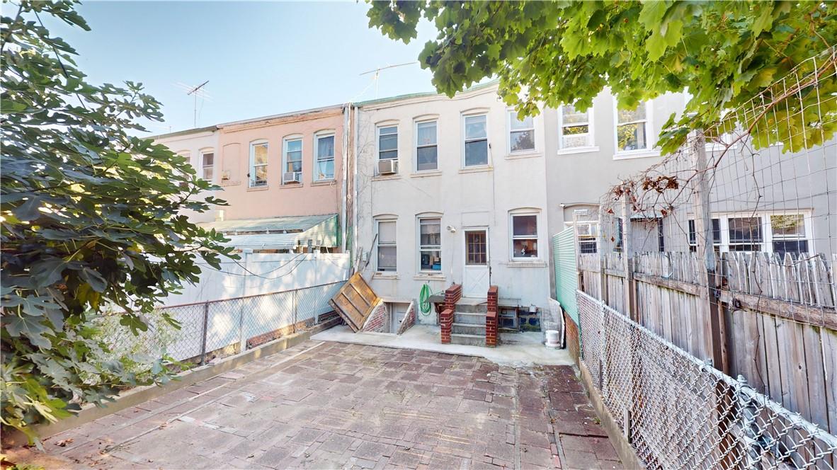 80-13 86th Road Queens, NY 11421 - Photo 12 of 18 a view of a building with a porch