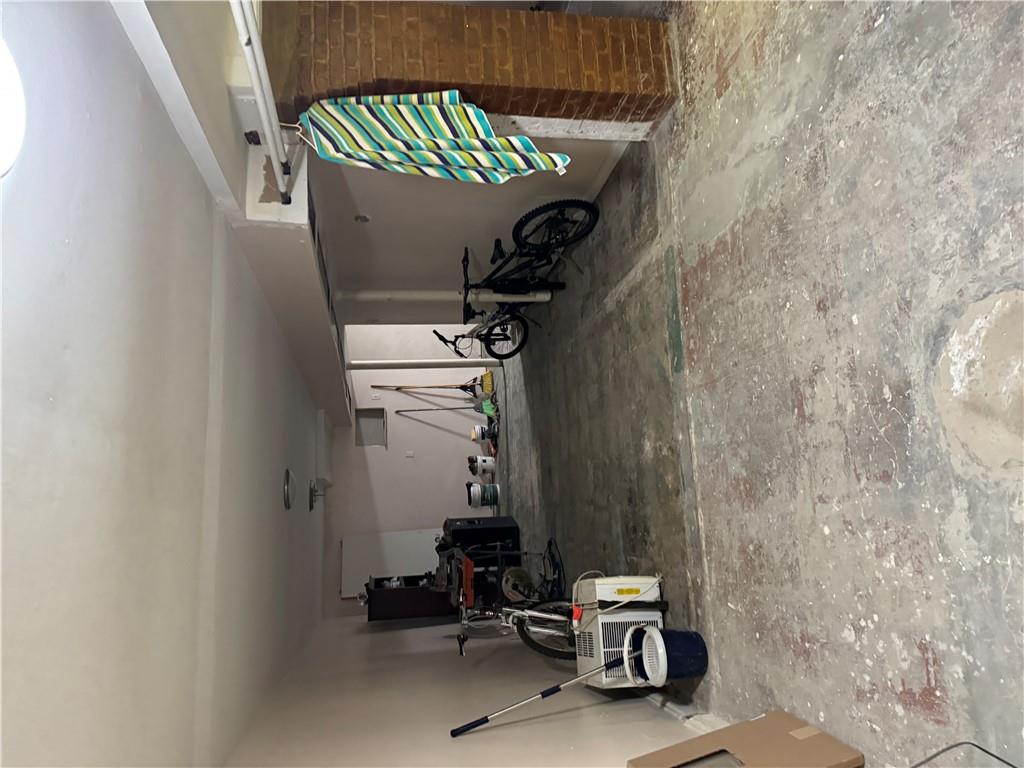 80-13 86th Road Queens, NY 11421 - Photo 15 of 18 a view of a garage with parked cars