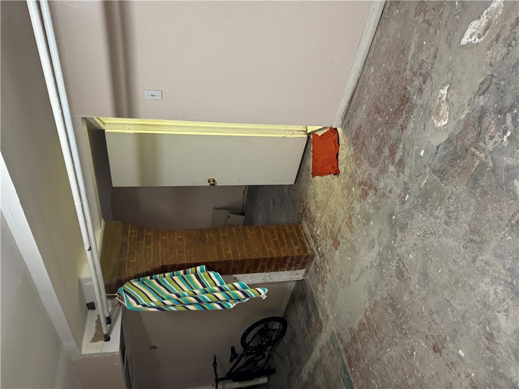 80-13 86th Road Queens, NY 11421 - Photo 16 of 18 a bedroom with a bed and a window