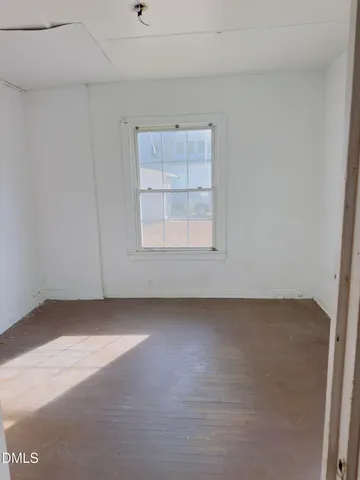 an empty room with a empty space and window