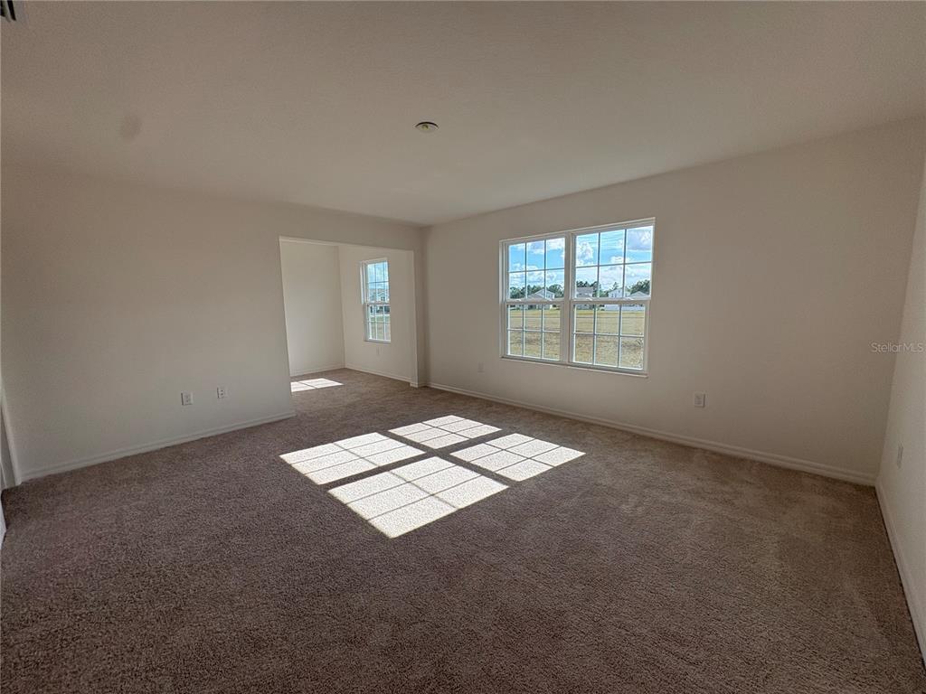 1587 Cloudy Court St. Cloud, FL 34769 - Photo 11 of 16 an empty room with windows