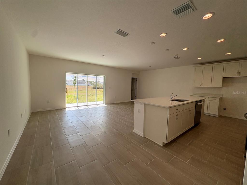 1587 Cloudy Court St. Cloud, FL 34769 - Photo 6 of 16 a view of a kitchen with a sink and a window