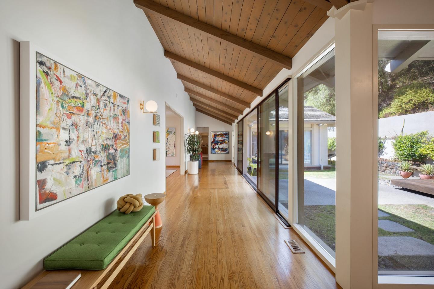 1275 La Canada Road Hillsborough, CA 94010 - Photo 12 of 85 a view of hallway with furniture and wooden floor