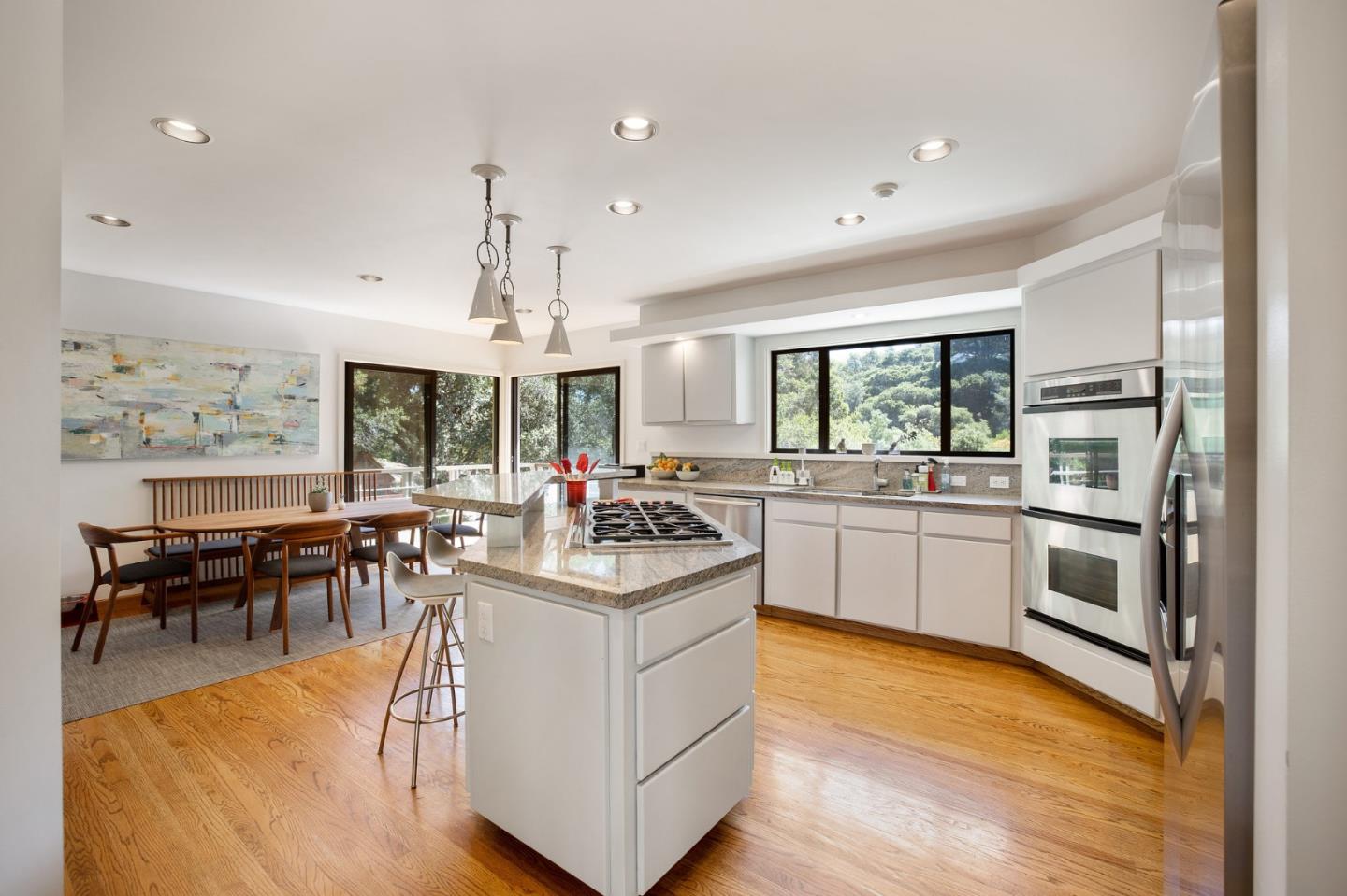 1275 La Canada Road Hillsborough, CA 94010 - Photo 20 of 85 a kitchen with a sink stove and cabinets