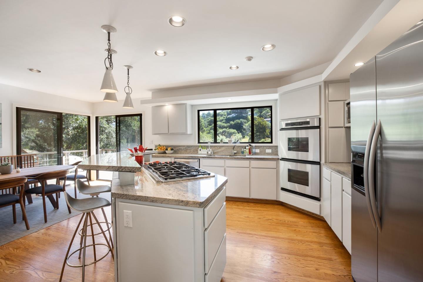 1275 La Canada Road Hillsborough, CA 94010 - Photo 21 of 85 a kitchen with refrigerator a stove and chairs