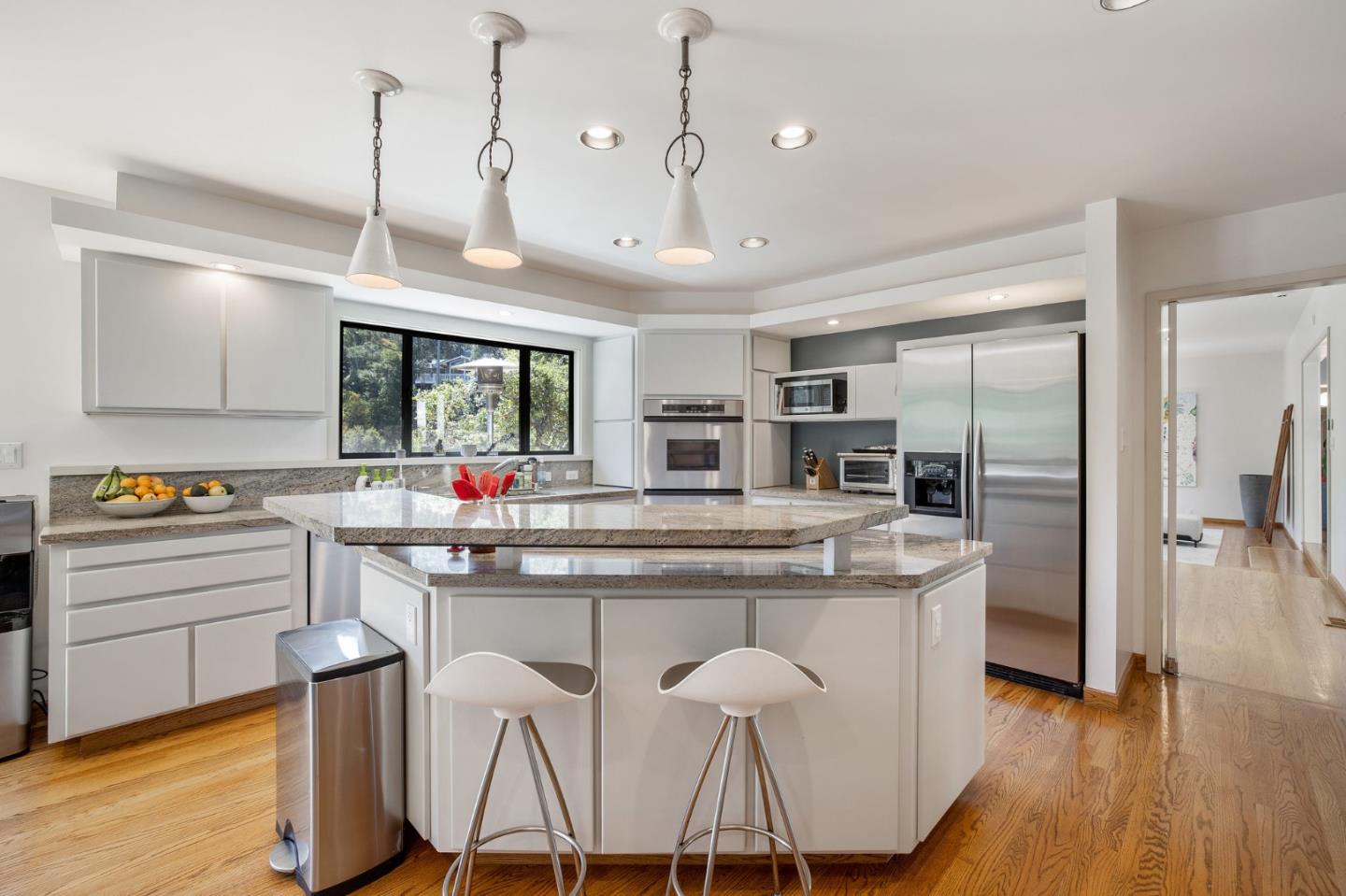 1275 La Canada Road Hillsborough, CA 94010 - Photo 22 of 85 a kitchen with counter top space and wooden floor
