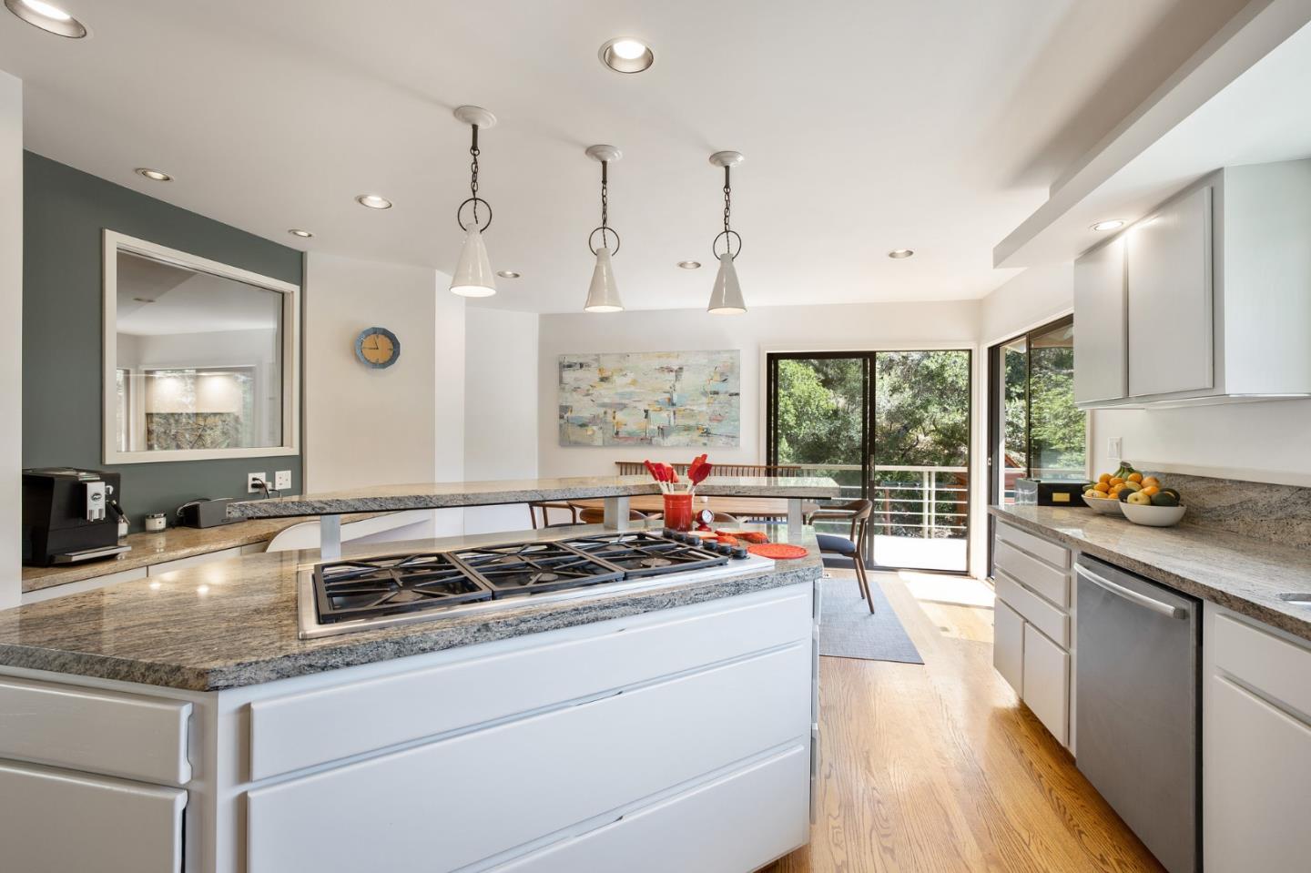 1275 La Canada Road Hillsborough, CA 94010 - Photo 25 of 85 a kitchen with sink stove and cabinets