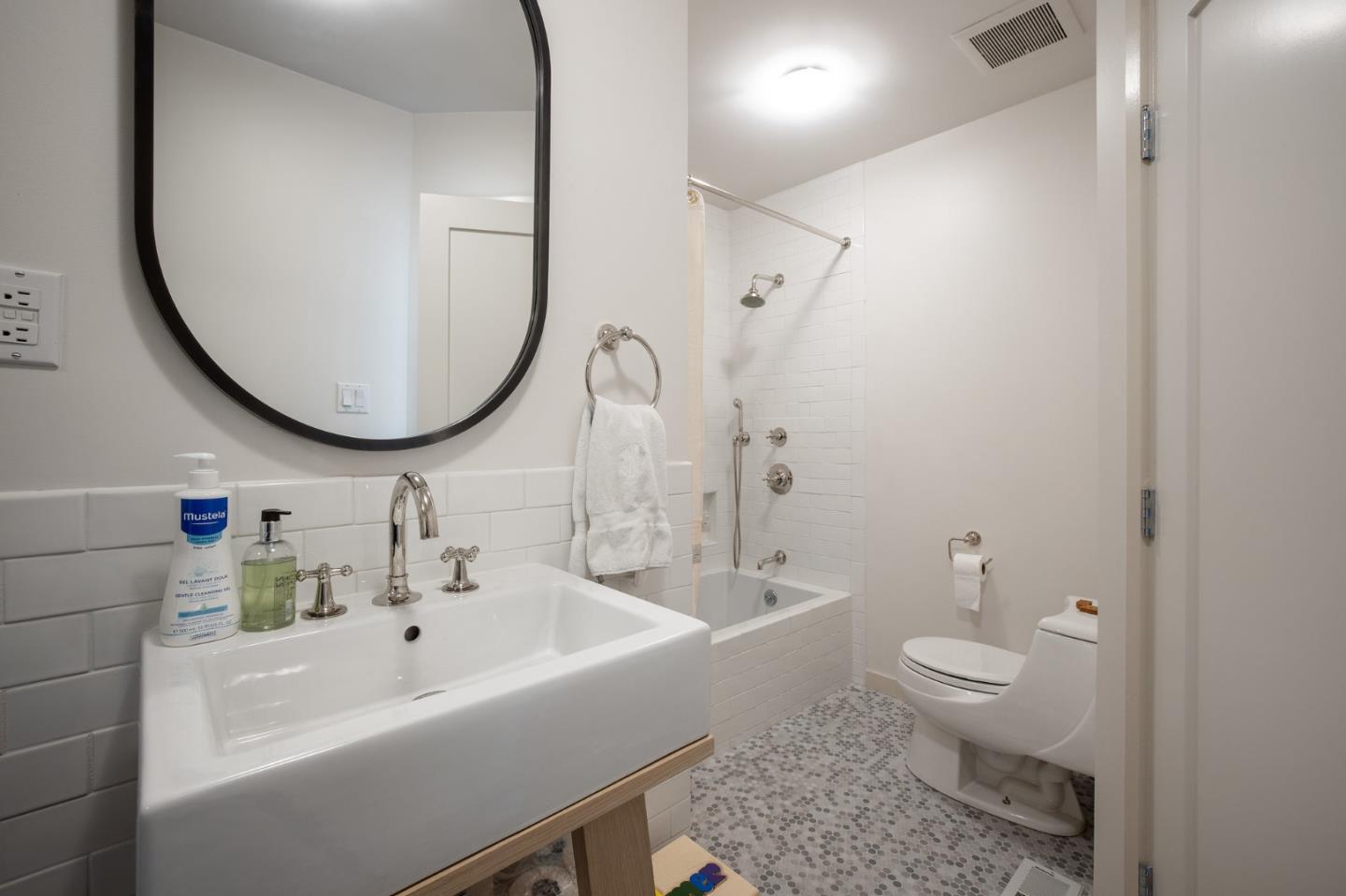 1275 La Canada Road Hillsborough, CA 94010 - Photo 35 of 85 a bathroom with a sink a toilet and a mirror