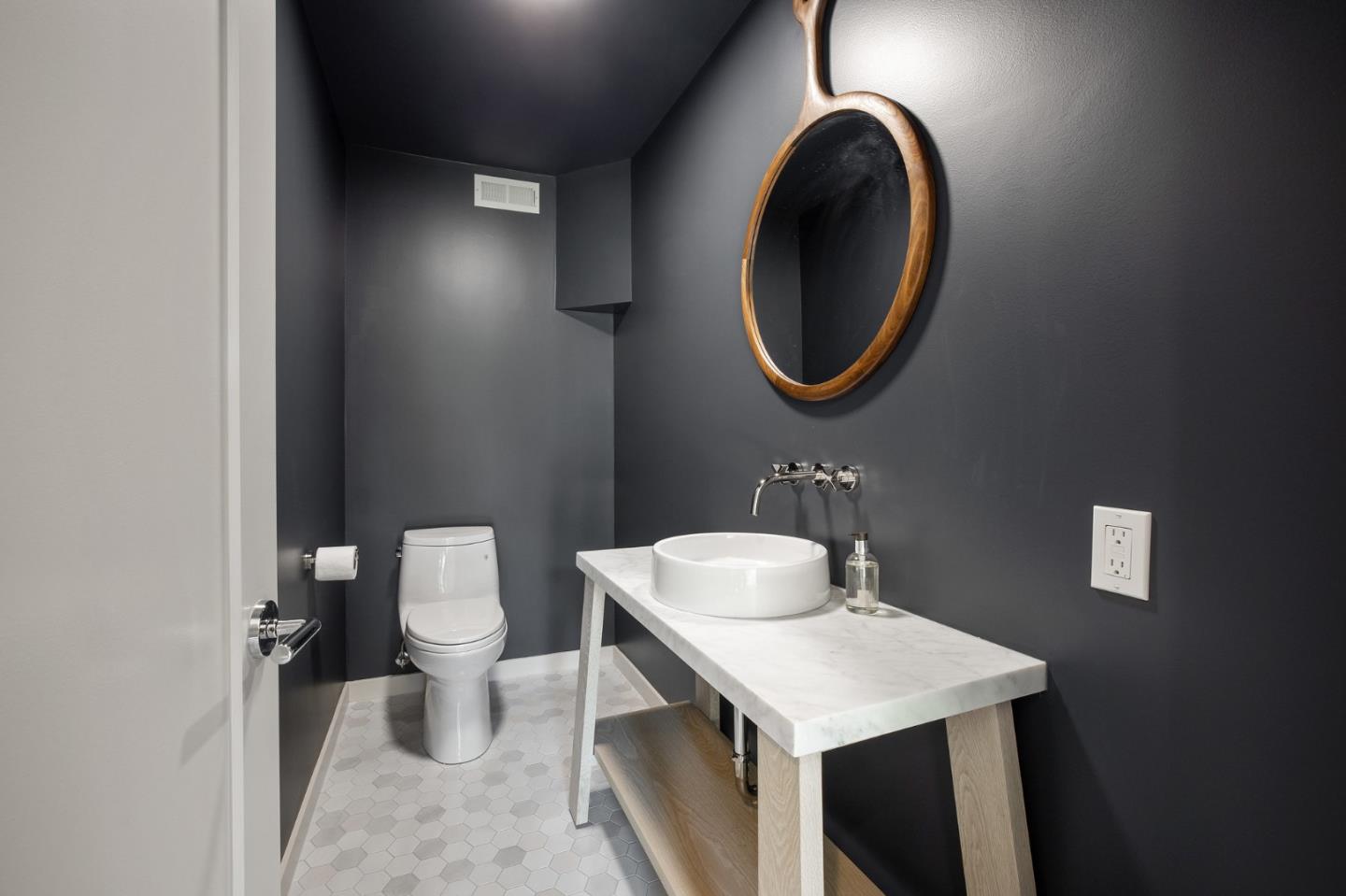 1275 La Canada Road Hillsborough, CA 94010 - Photo 42 of 85 a bathroom with a toilet a sink and a mirror