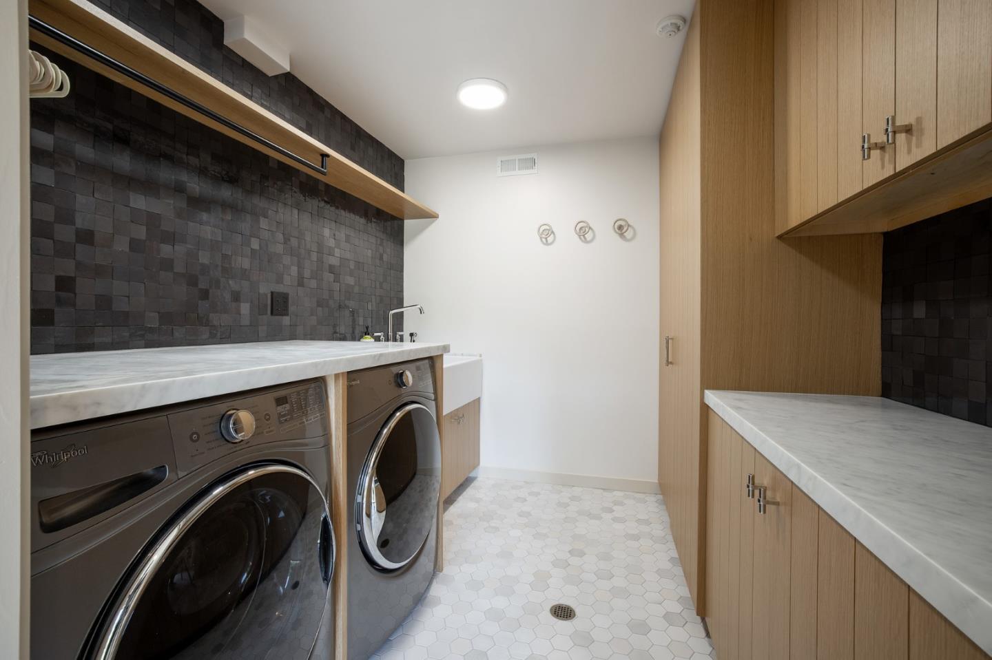 1275 La Canada Road Hillsborough, CA 94010 - Photo 44 of 85 a utility room with dryer and washer
