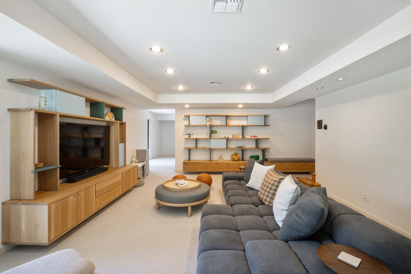 1275 La Canada Road Hillsborough, CA 94010 - Photo 47 of 85 a living room with furniture and a flat screen tv