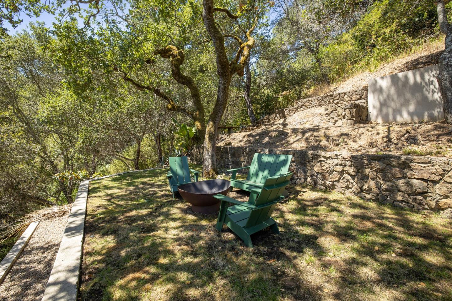 1275 La Canada Road Hillsborough, CA 94010 - Photo 49 of 85 a backyard of a house with table and chairs