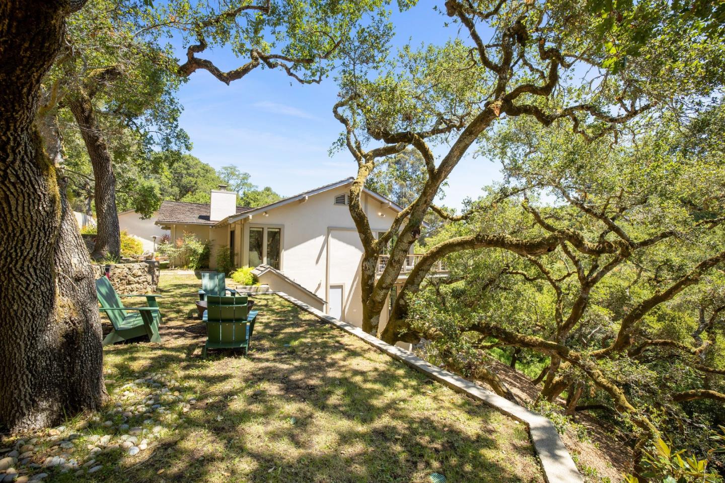 1275 La Canada Road Hillsborough, CA 94010 - Photo 50 of 85 a view of a house with backyard porch and sitting area
