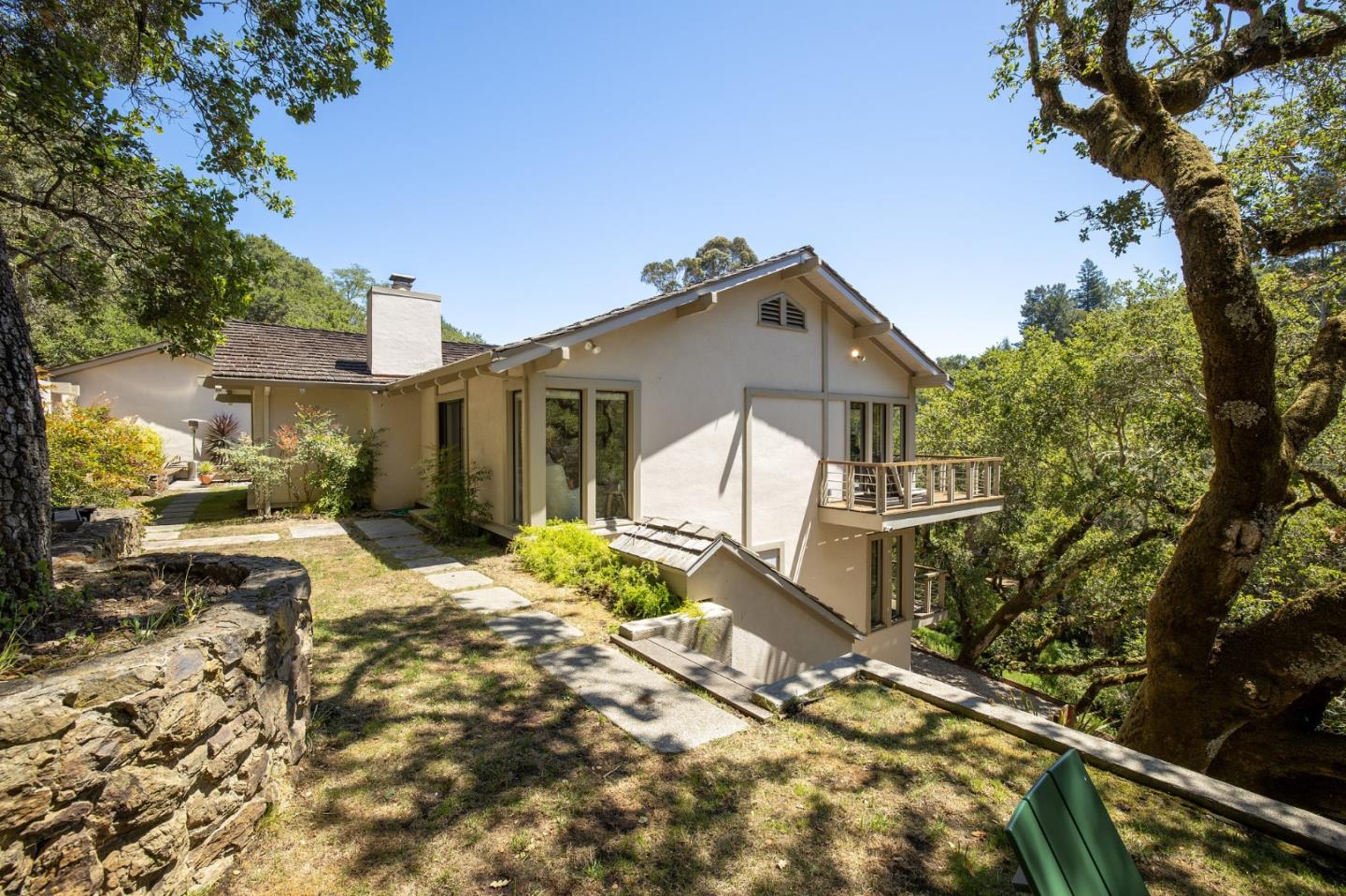 1275 La Canada Road Hillsborough, CA 94010 - Photo 51 of 85 a view of a house with a small yard and large tree
