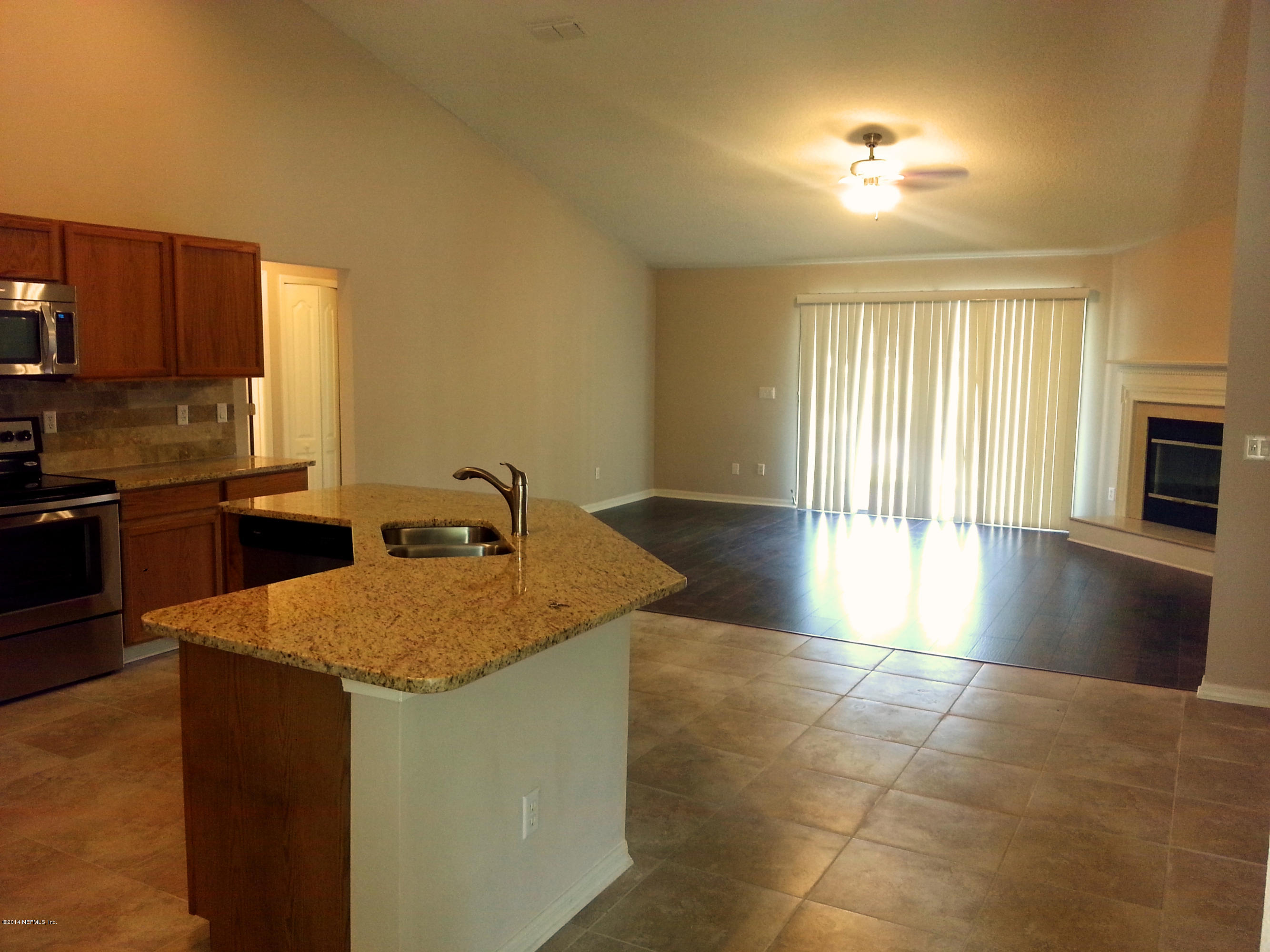 10198 Rising Mist Lane Jacksonville, FL 32221 - Photo 10 of 19 KITCHEN TO FAMILY ROOM