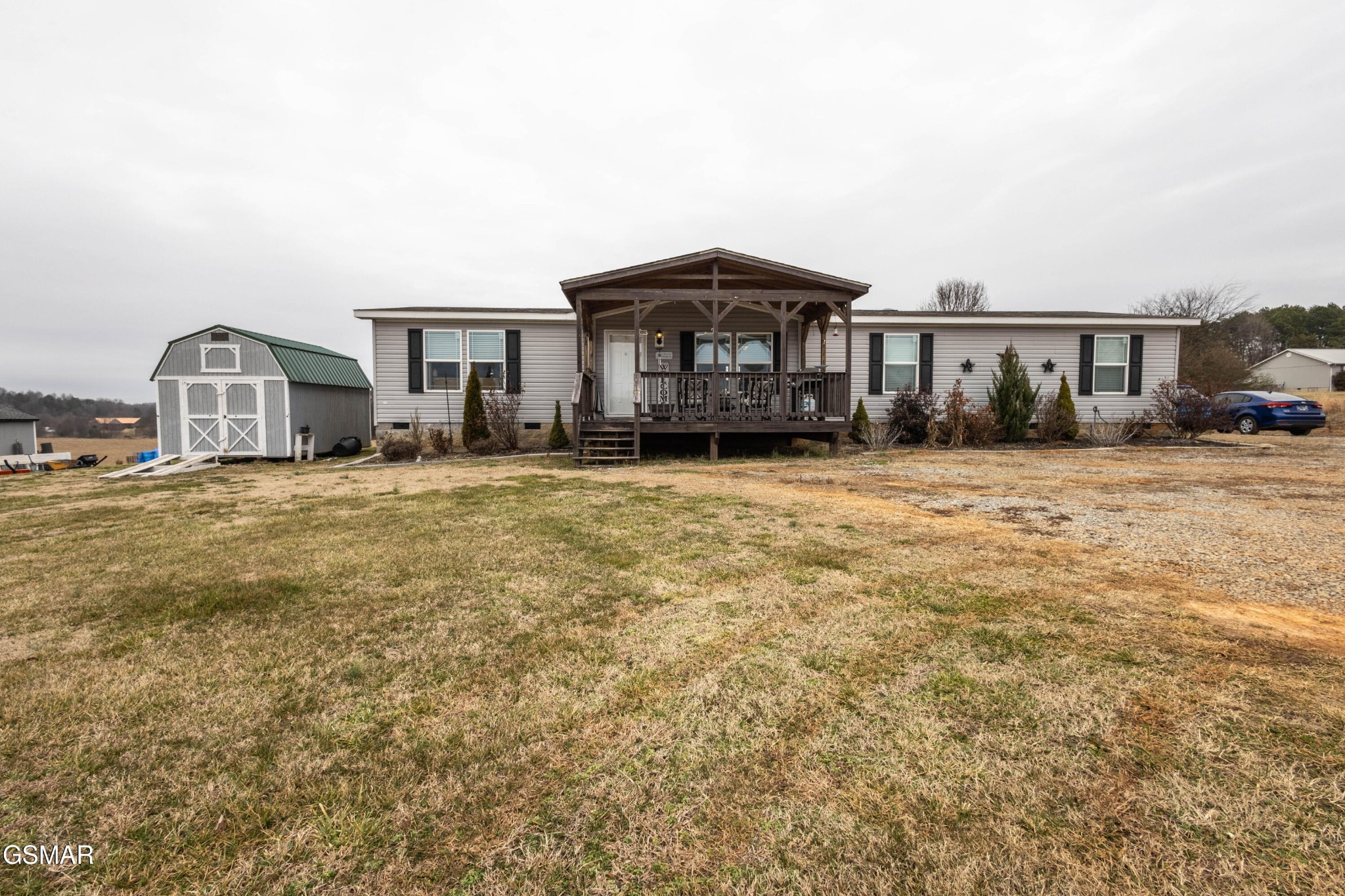 1165 Ballplay Road Madisonville, TN 37354 - Photo 1 of 34 a big house with a big yard and large trees