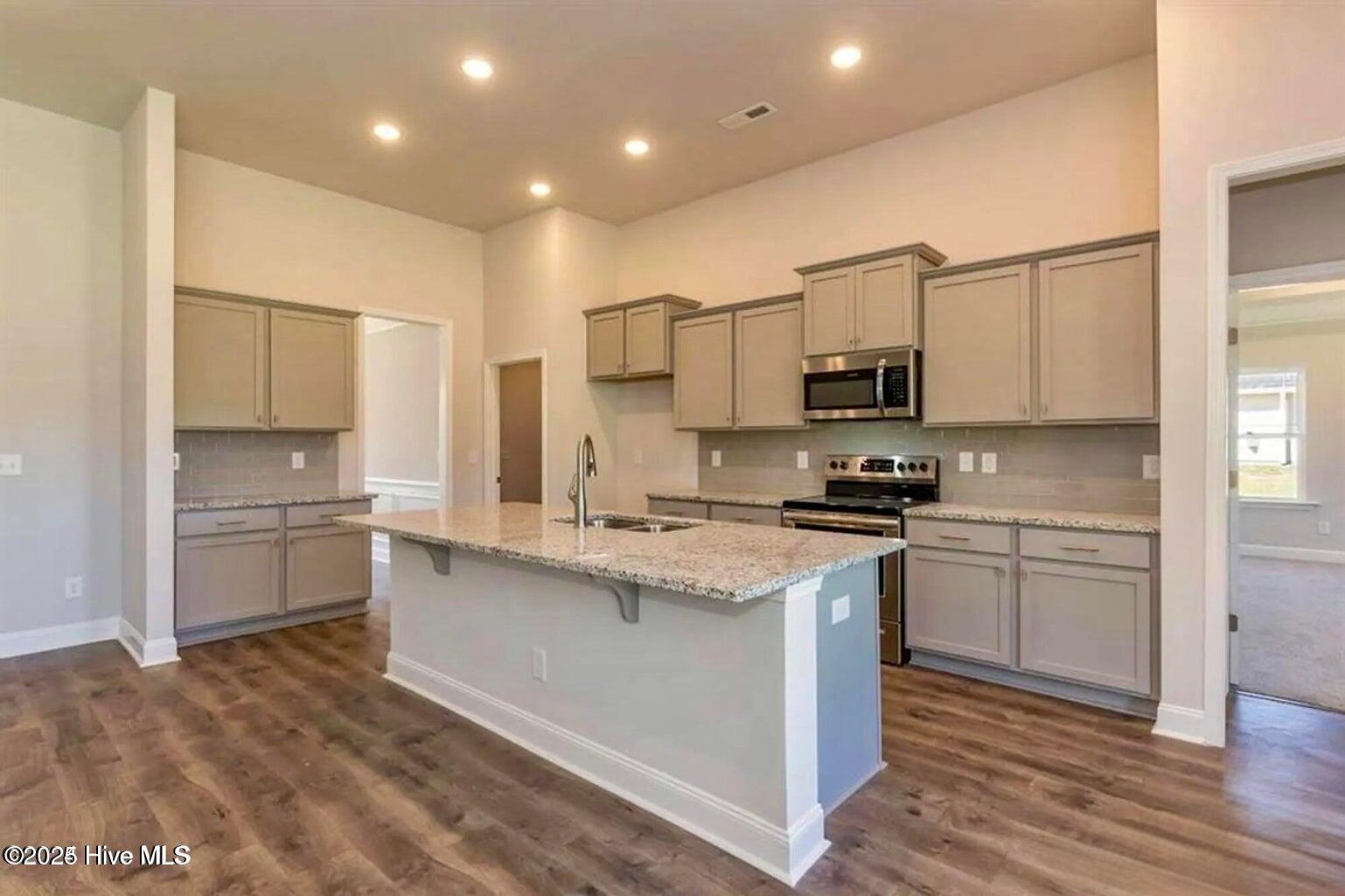 162 Poker House Road Grimesland, NC 27837 - Photo 22 of 27 Kitchen. Photos are of the same floor plan in a different community and are for layout and demo purposes only. Upgrades, colors and finishes may differ. Home is currently under construction.