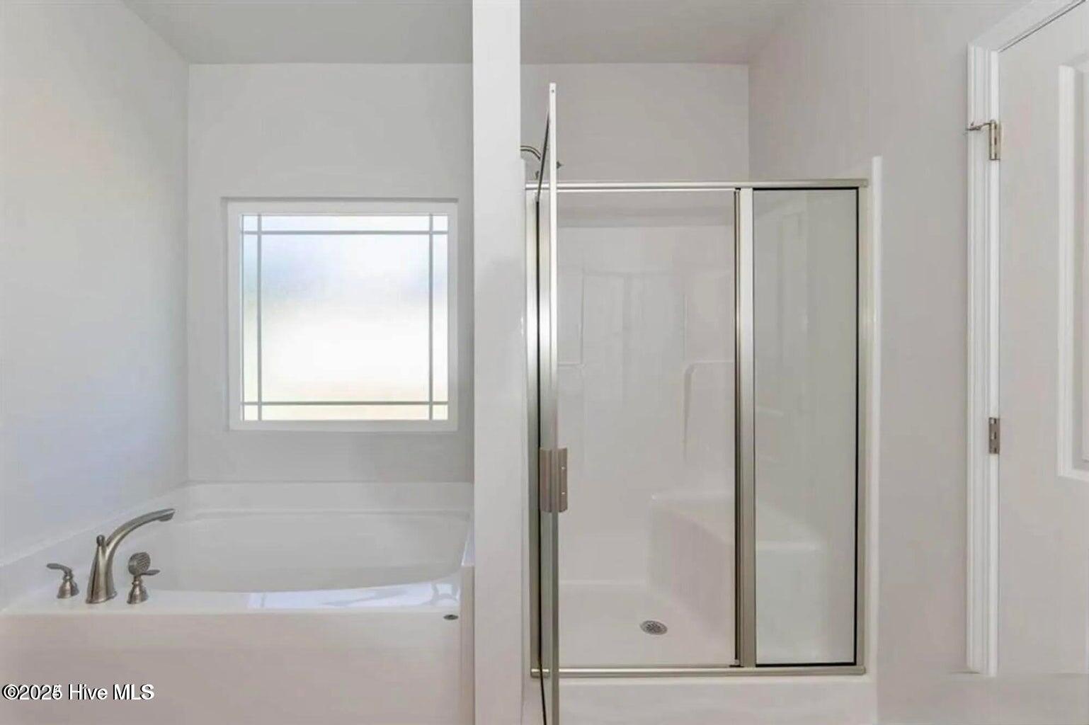 162 Poker House Road Grimesland, NC 27837 - Photo 26 of 27 Tub-and-shower option. Photos are of the same floor plan in a different community and are for layout and demo purposes only. Upgrades, colors and finishes may differ. Home is currently under construction.