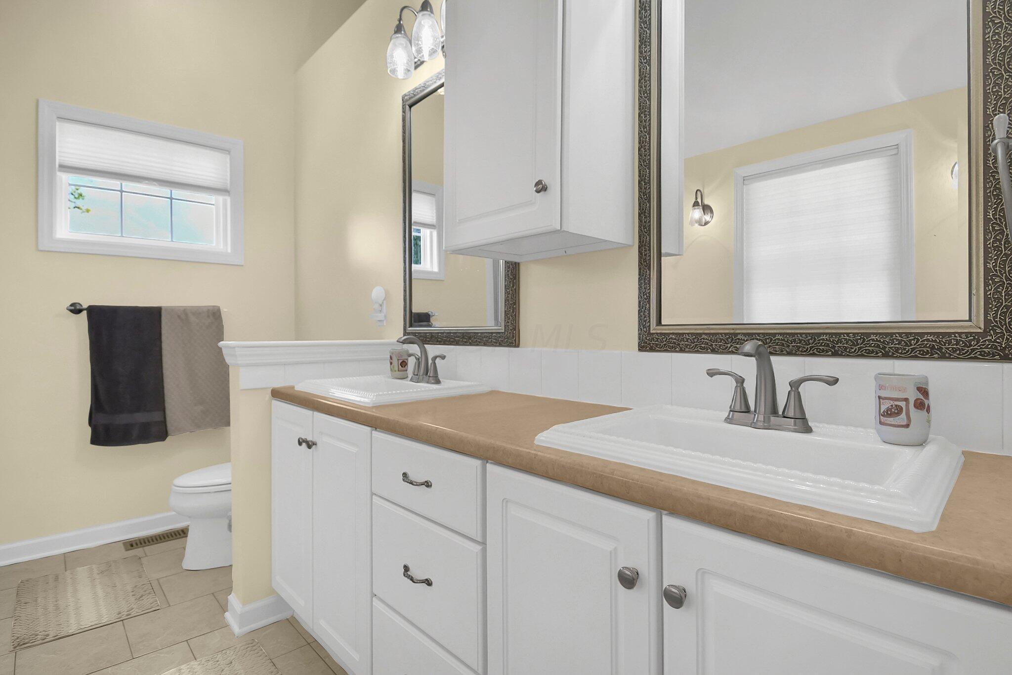 1717 Cedar Hill Road Lancaster, OH 43130 - Photo 20 of 36 Double sinks in Master bedroom and spacious cabinets